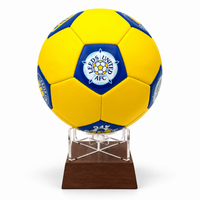 Leeds United FC football urn yellow with blue and white logo on wooden stand