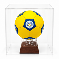Leeds United FC football urn yellow with blue and white logo on wooden stand in perspex display case
