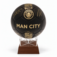 Manchester City black signature football urn on timber stand