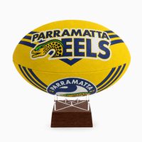 A yellow Parramatta Eels rugby ball urn displayed on a clear acrylic stand with a dark brown wooden base, set against a plain white background.