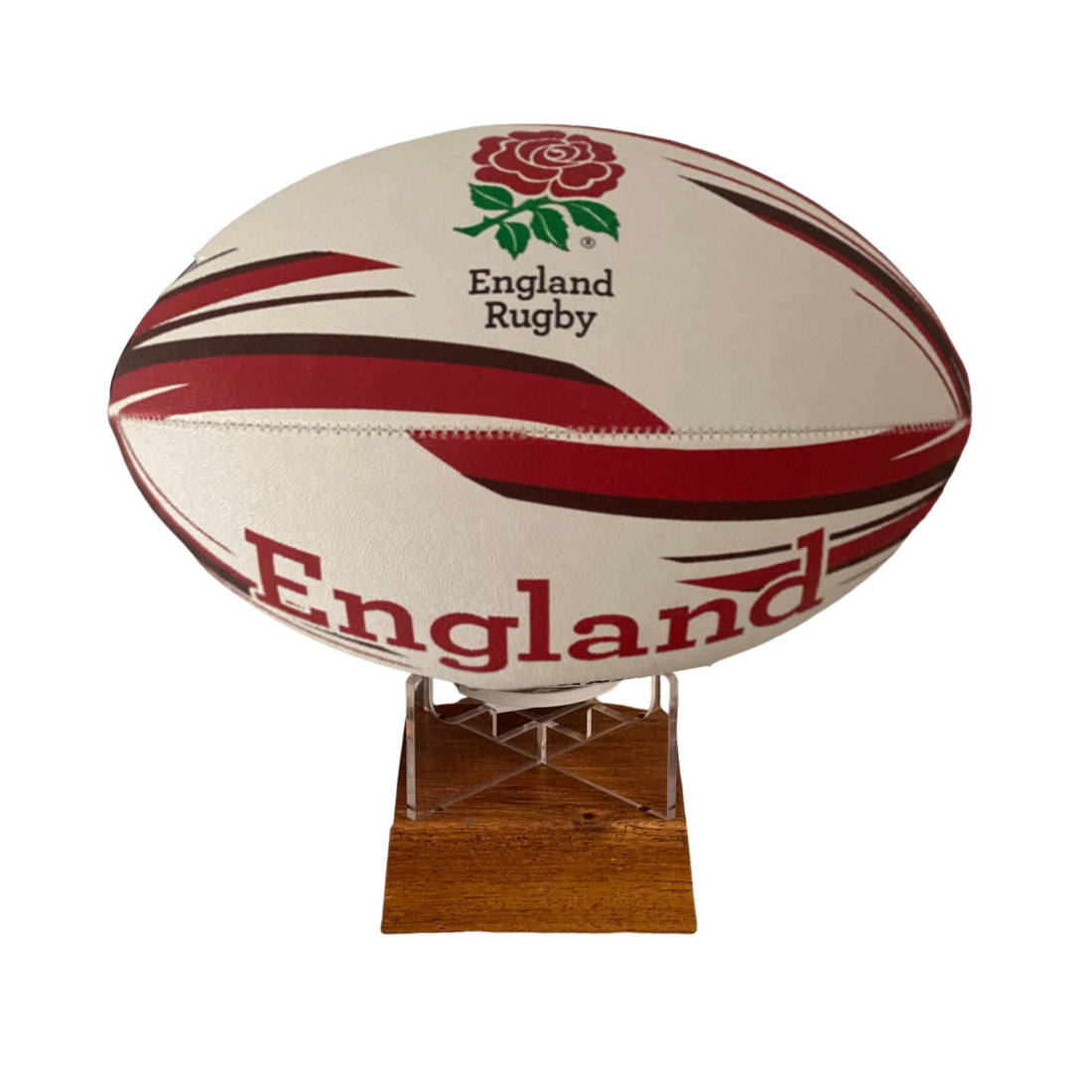 An England Rugby rugby ball urn with red and black stripes, displayed on a clear acrylic stand over a wooden base against a white background.