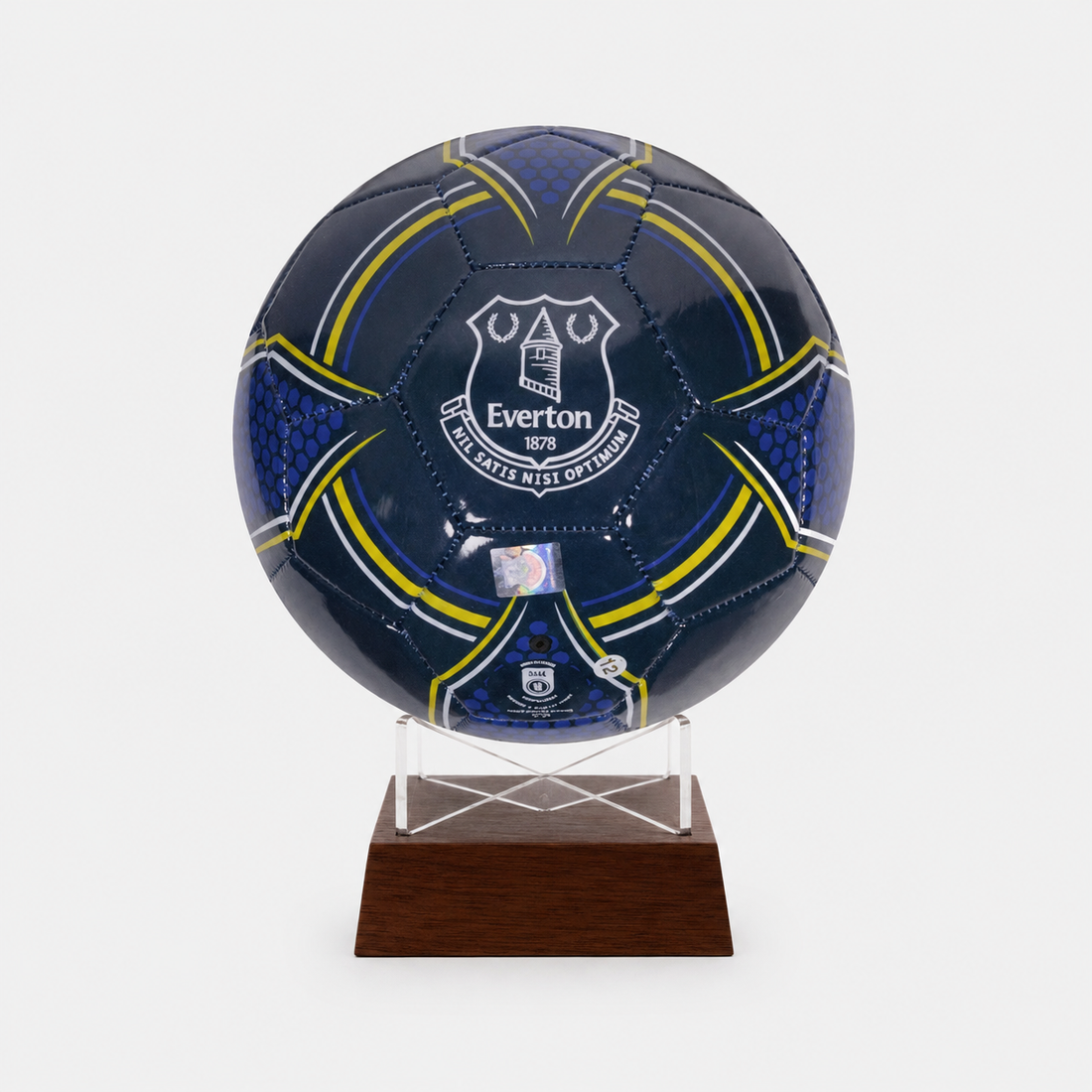 A dark blue Everton soccer ball urnmounted on a clear acrylic stand with a wooden base, shown against a light gray background.