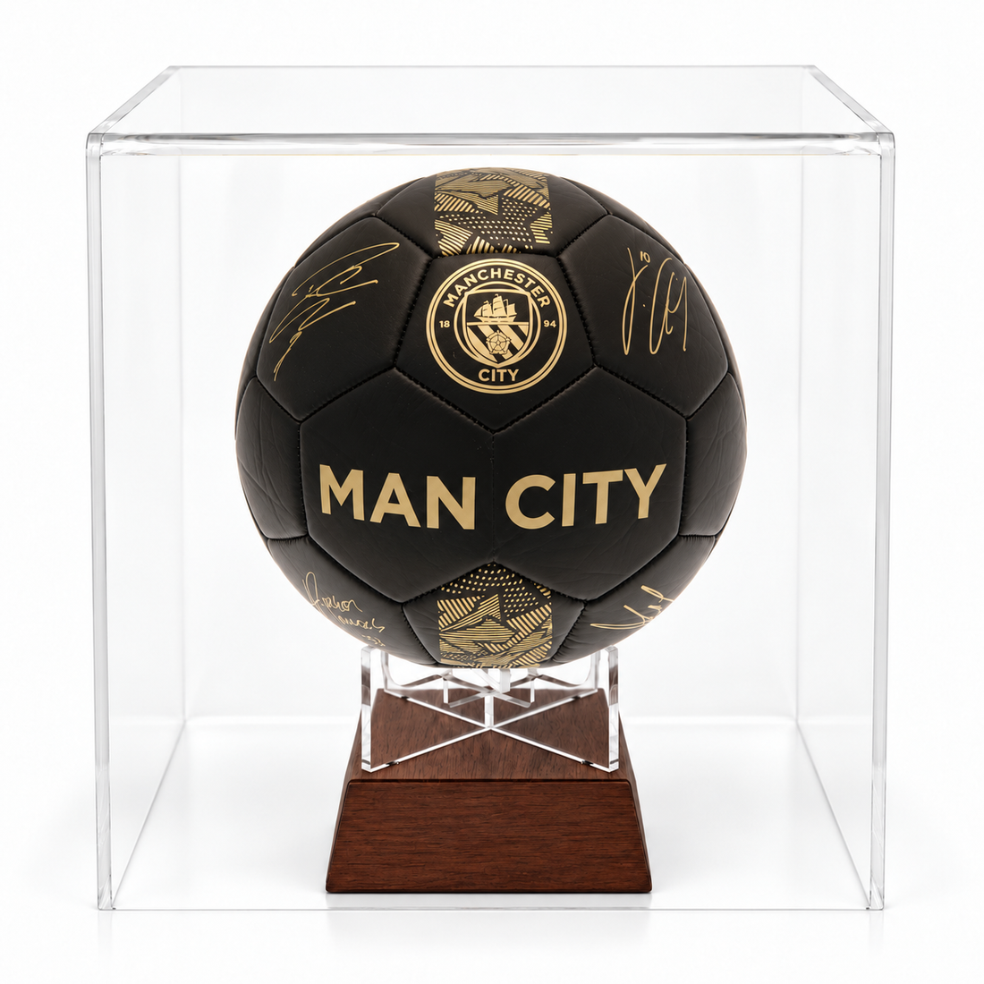 Manchester City black signature football urn on timber stand in perspex display case