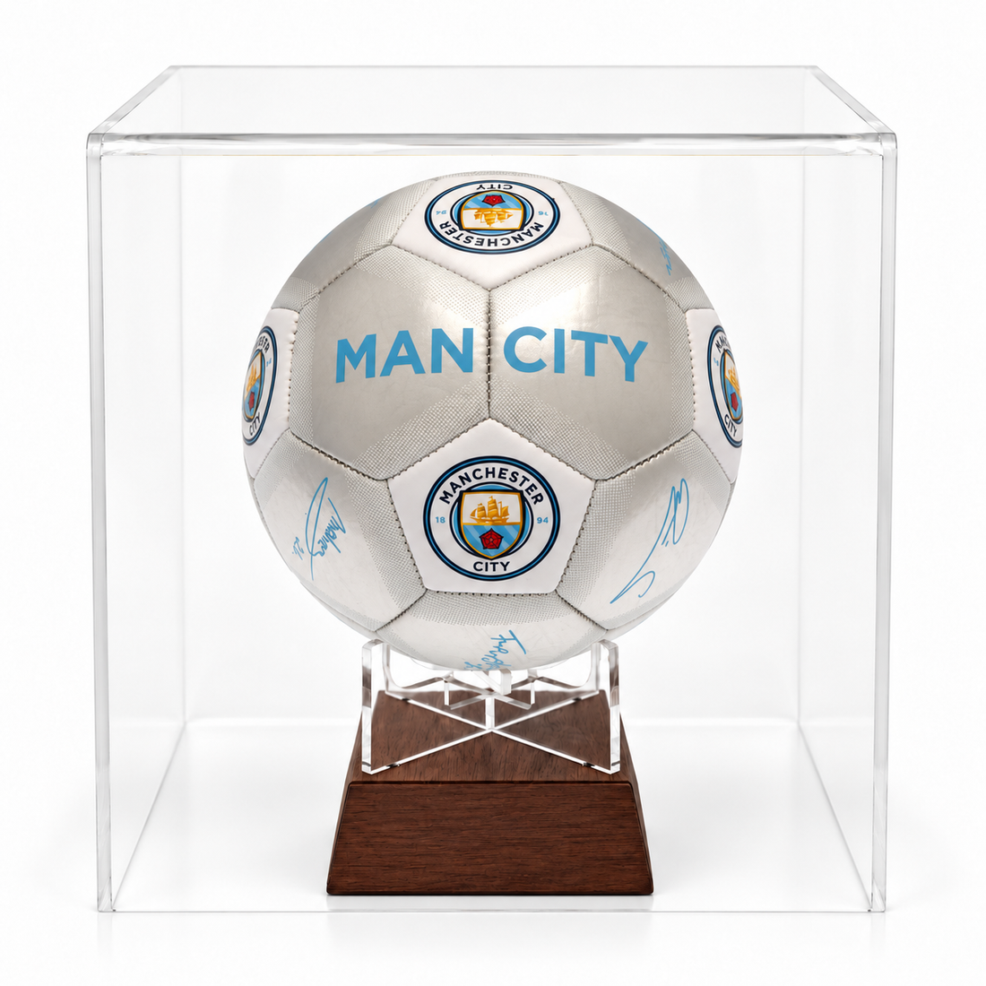 Manchester City silver signature football urn on timber stand in perspex display case