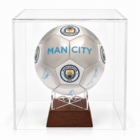 Manchester City silver signature football urn on timber stand in perspex display case
