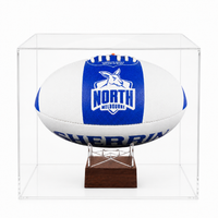 A white and blue North Melbourne Kangaroos AFL urn displayed inside a clear acrylic display case on a small wooden stand, photographed against a clean white background
