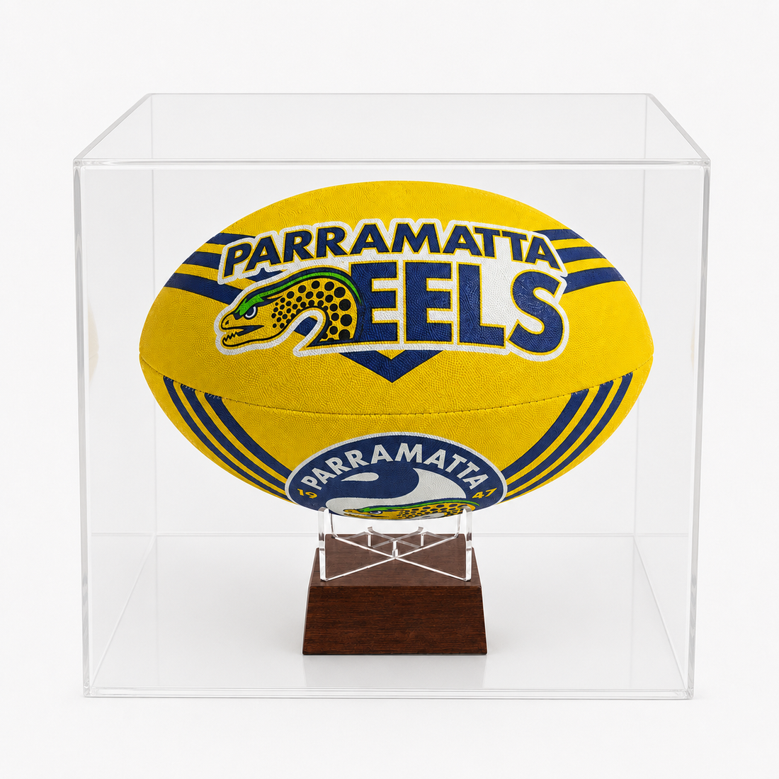 A yellow Parramatta Eels rugby ball urn displayed inside a clear acrylic display case on a small wooden stand, photographed against a clean white background.
