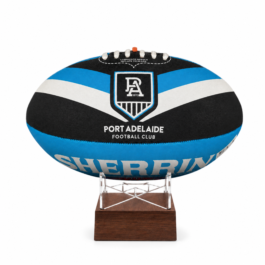 A custom Port Adelaide Football Club rugby ball  urn with a black, blue, and white striped design, displayed on a clear acrylic stand with a dark brown wooden base against a white background.