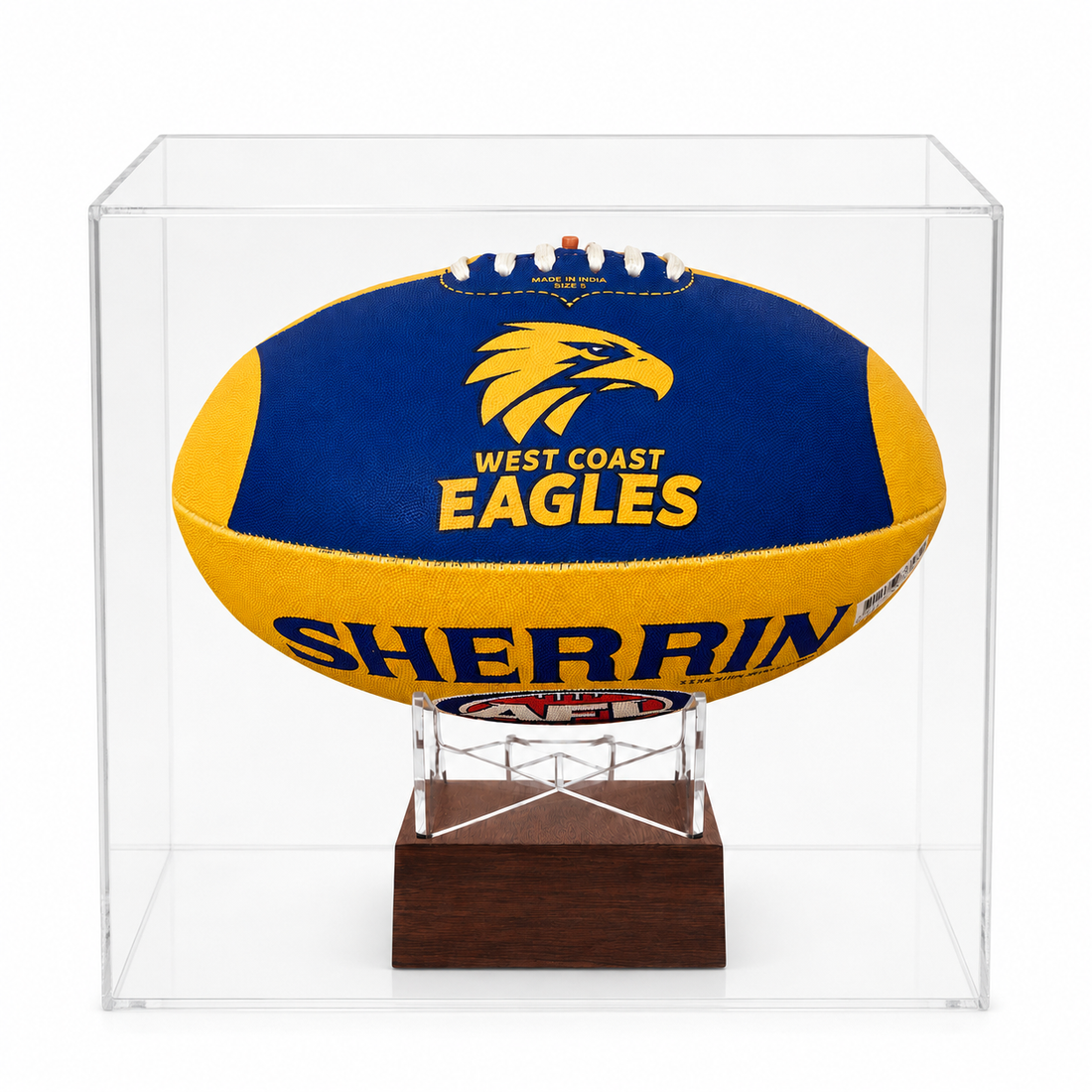 A West Coast Eagles AFL ball urn displayed inside a clear acrylic display case on a wooden stand, photographed against a clean white background.